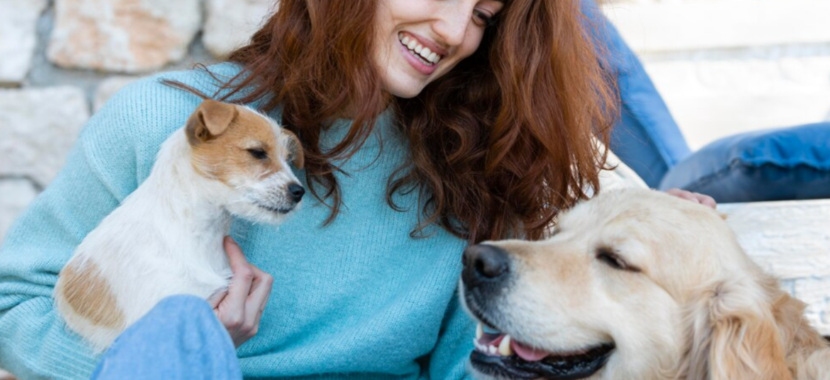 Woman Laughing with her Two Dogs